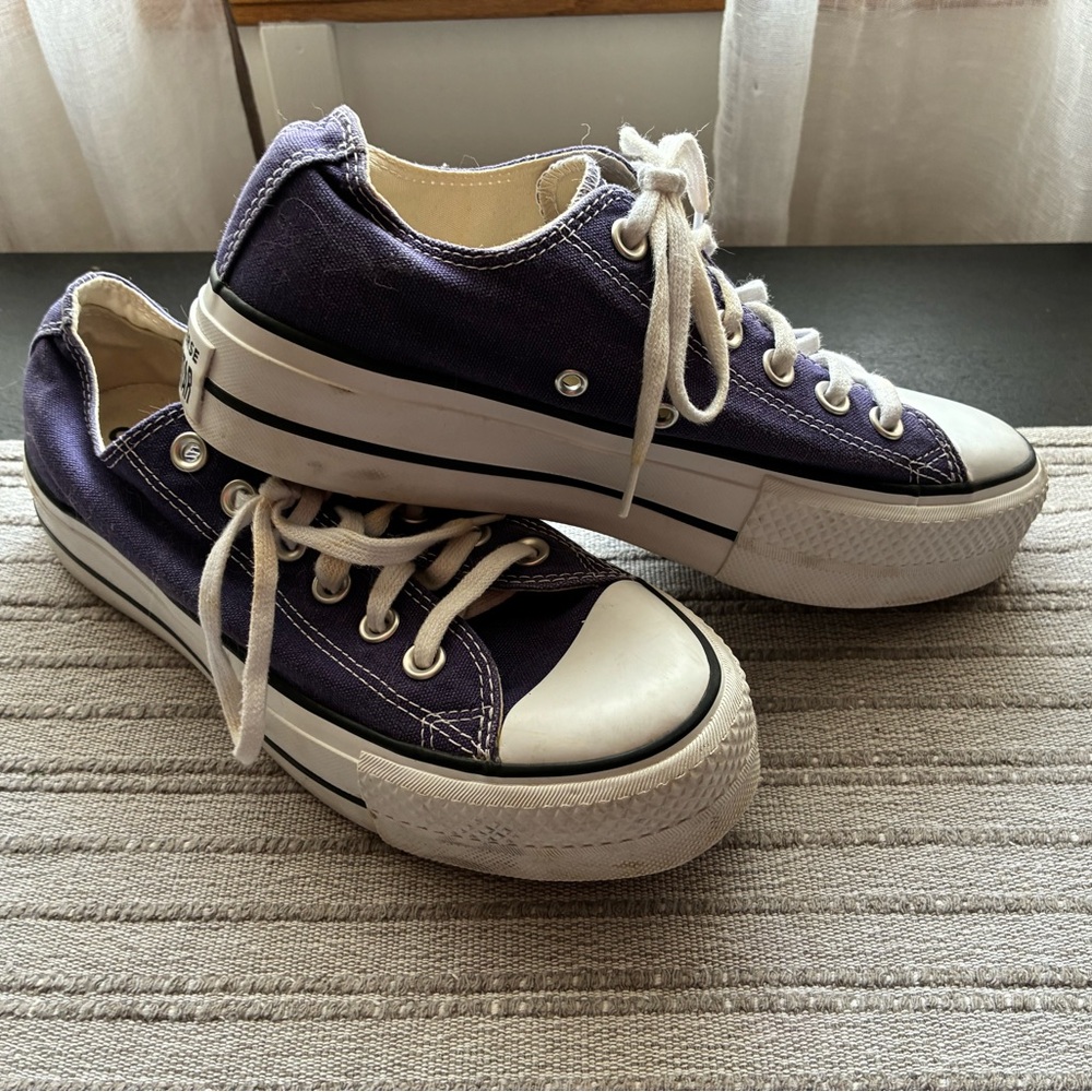 Dark blue canvas, Chuck Taylor platform sneakers.